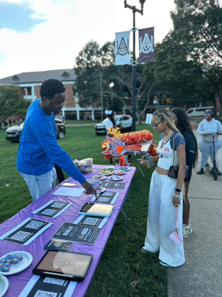 CCF members connecting with students at a campus outreach table