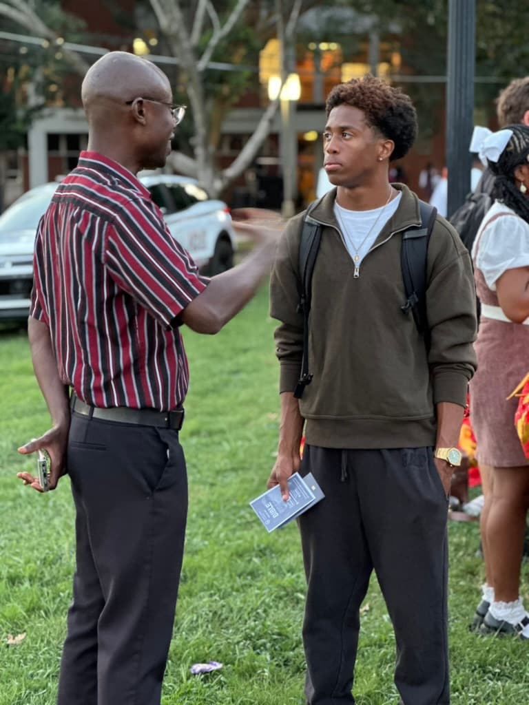 Students connecting at the Compass Campus Fellowship booth